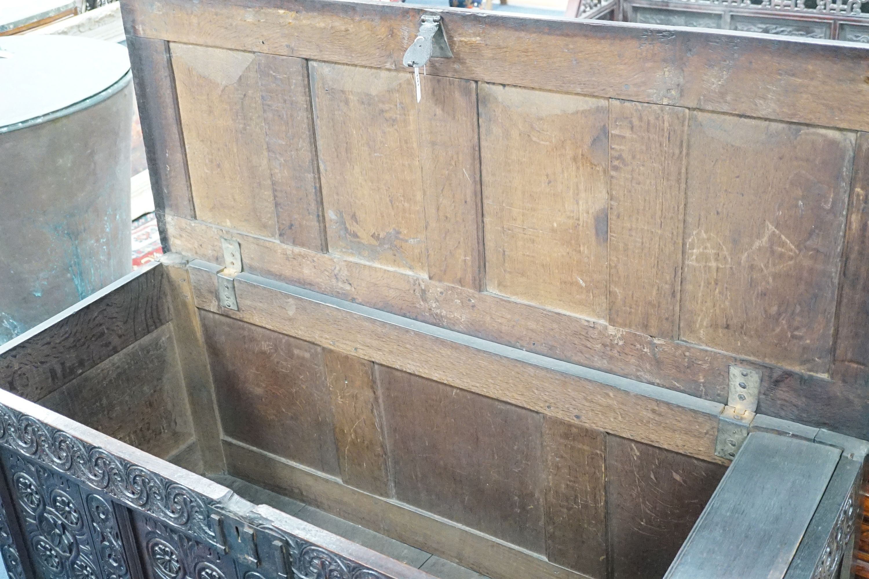 A 17th century Gloucestershire area carved, panelled oak coffer, length 150cm, depth 58cm, height 69cm